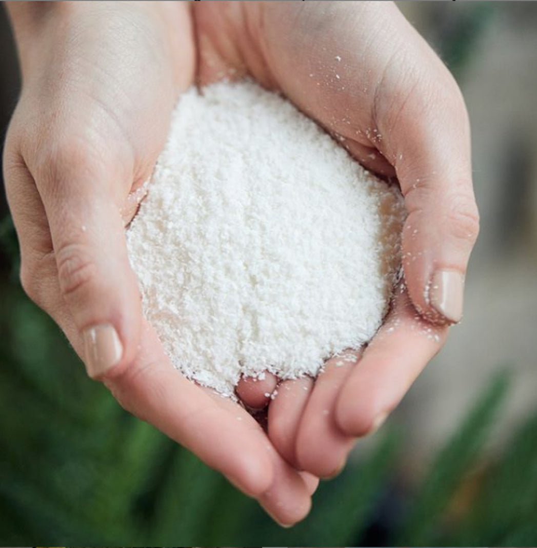 Hands with white powder laundry soap